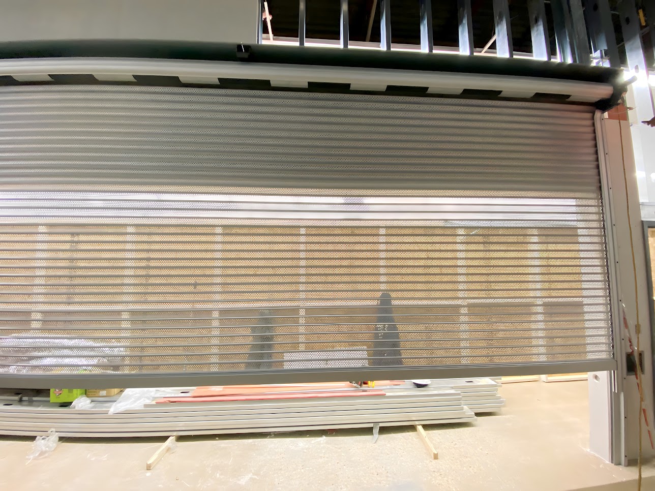 an xl12 shutter after being installed to cover a wide opening for a pharmacy