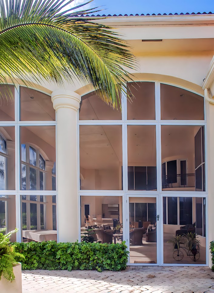 hurricane and storm screens protect a house in Florida