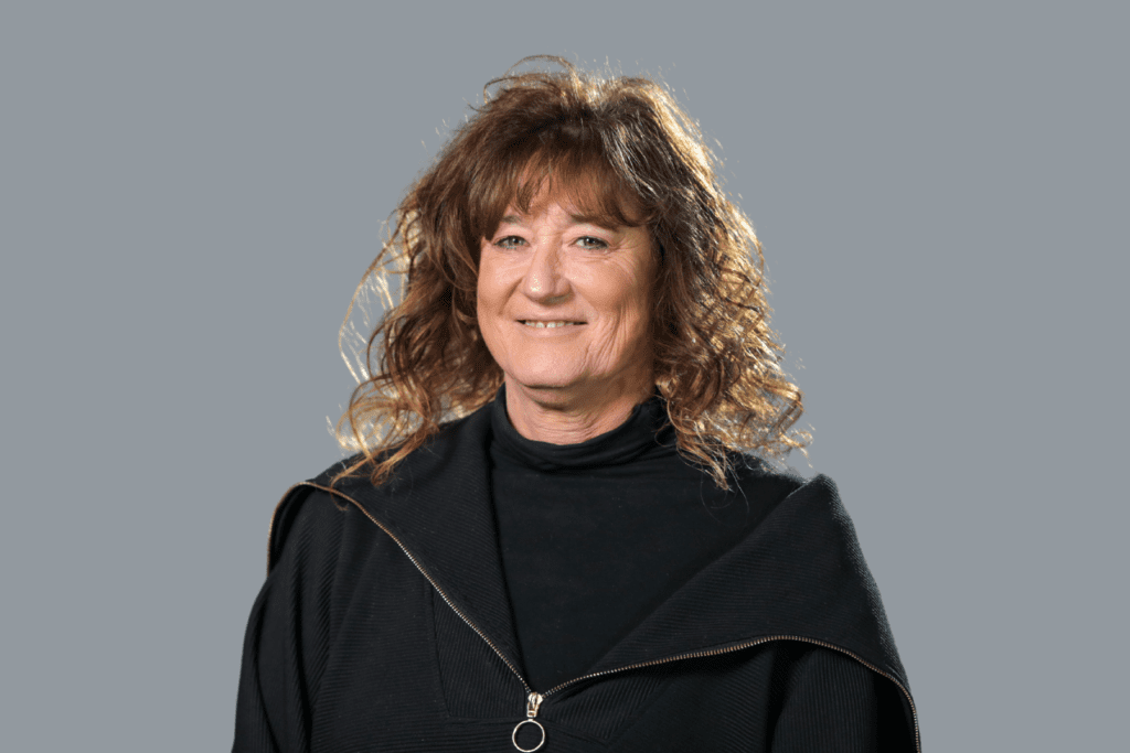 woman with curly hair wearing a black shirt