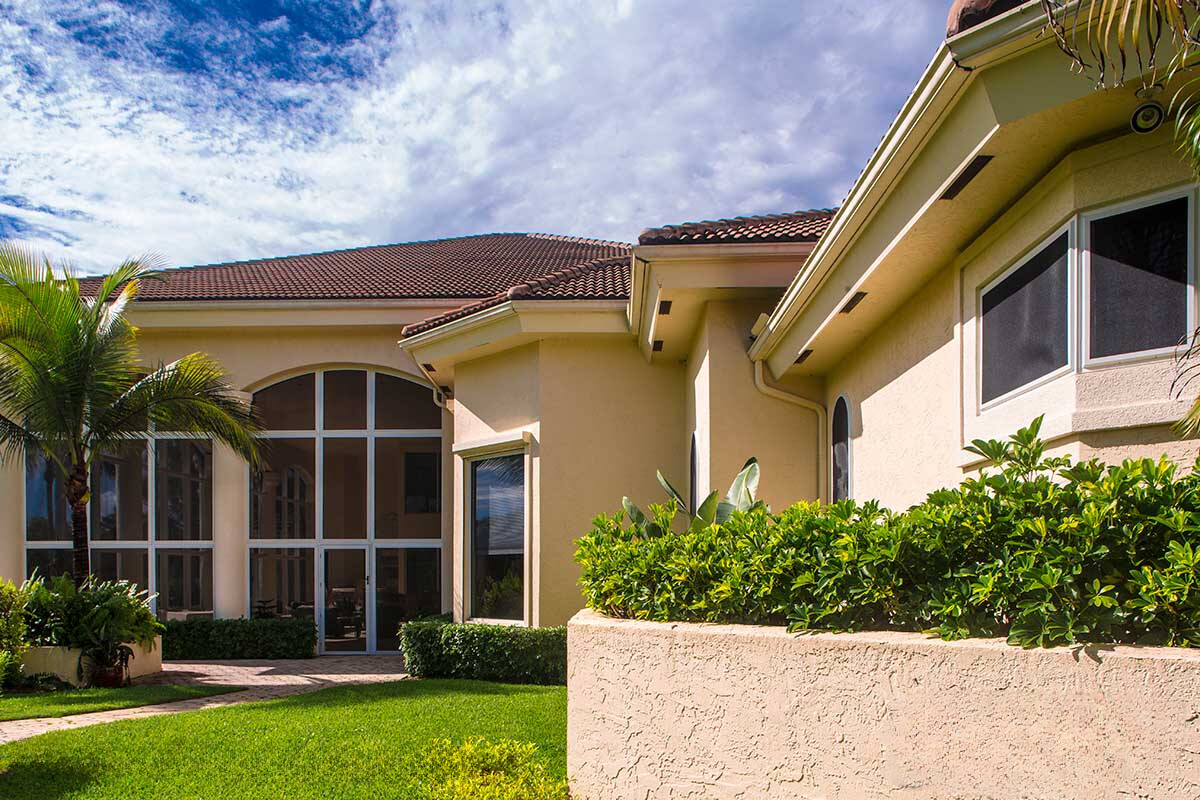 High end home in Florida with hurricane and security screens protecting its windows