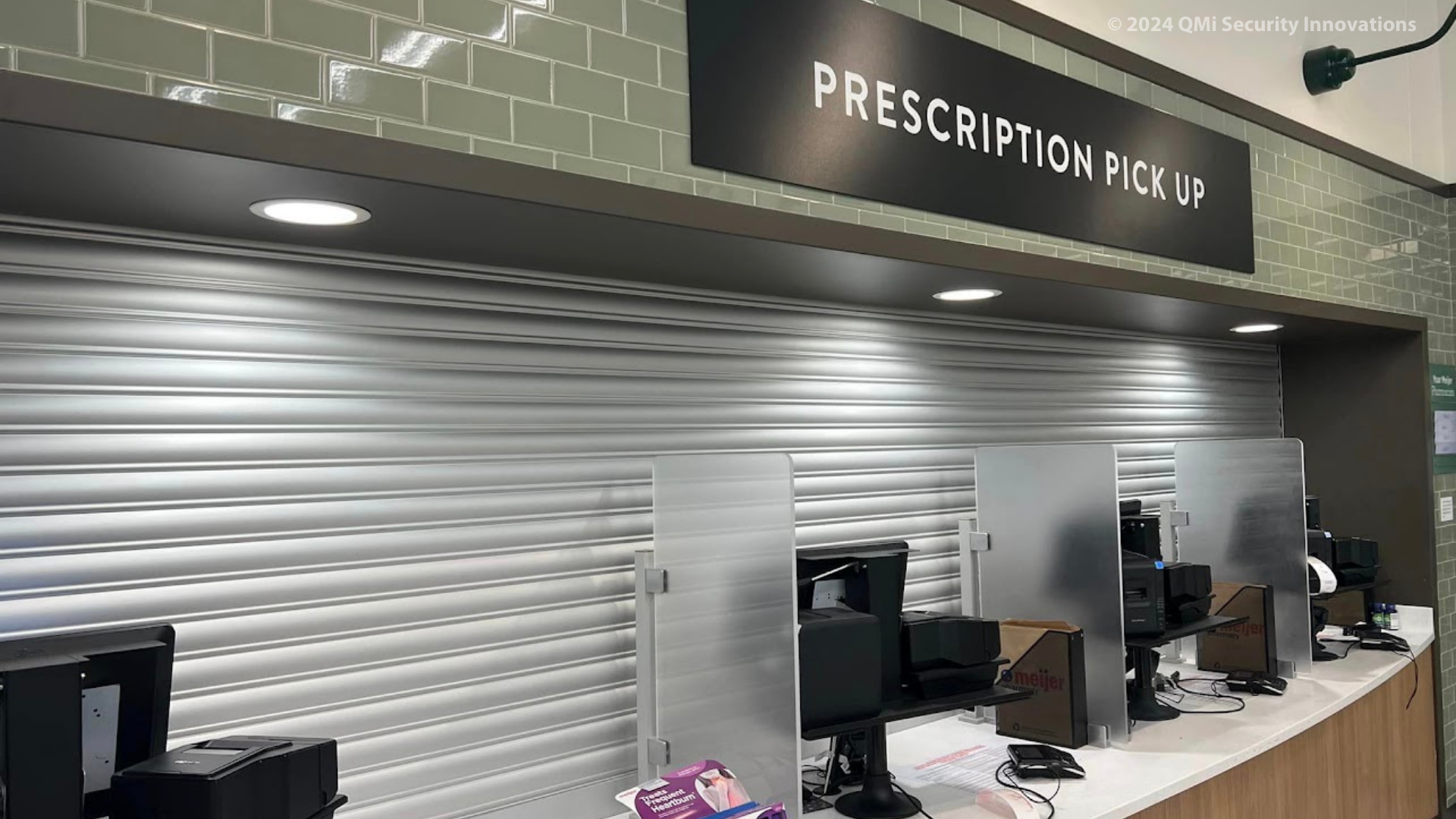 a pharmacy uses solid security shutters to protect its counter while closed.